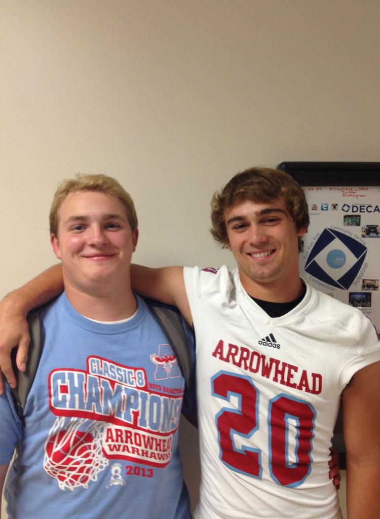 Caption Justin Radtke (left) and Johnny Marquardt (right) smile for the camera as two former AHS reporters