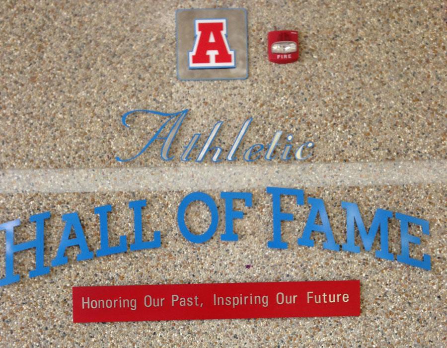 The Athletic Hall of Fame sign located in the North Campus Gym foyer. 