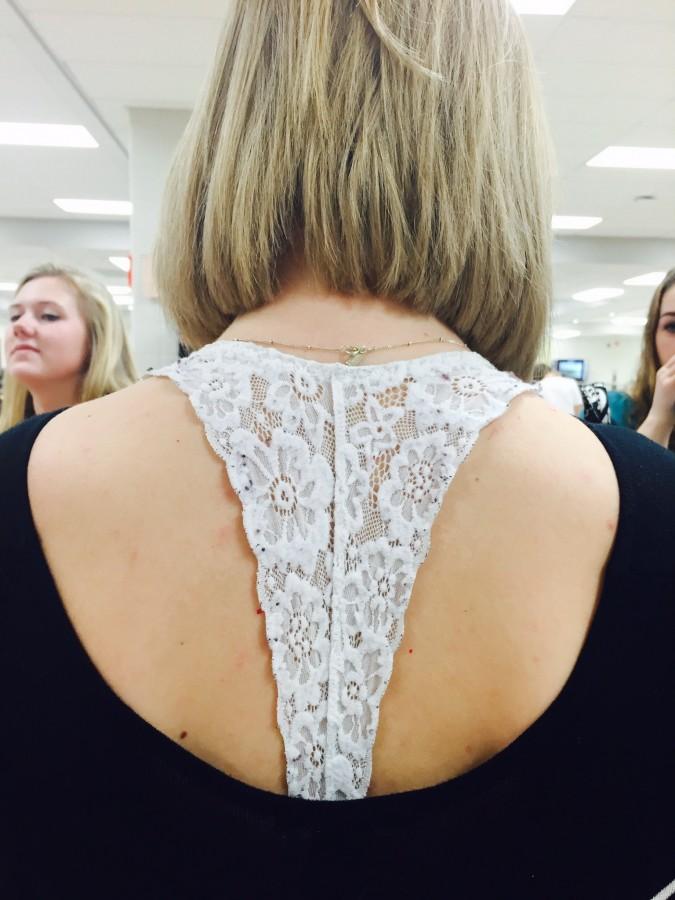 Senior Andi Eckl shows off her white lace bralette, purchased form Aerie