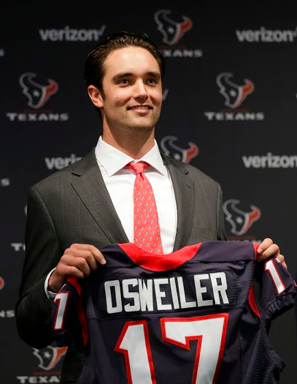 Brock Osweiler holds his Jersey for the cameras during his signing with the Houston Texans on March 9th.