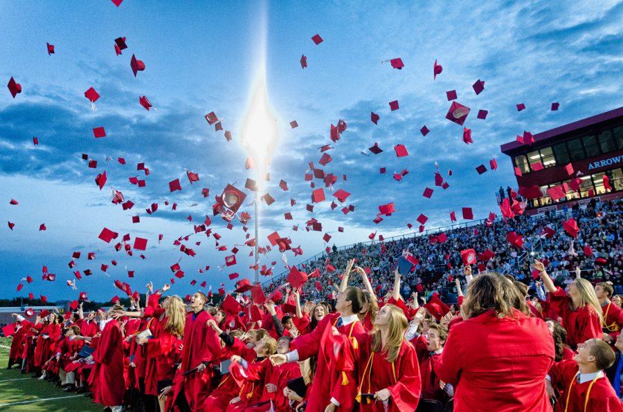 The Arrowhead High School class of 2013 throws their caps into the air in celebration at the end of their graduation ceremony. June 8th, 2013, Hartland, Wi.