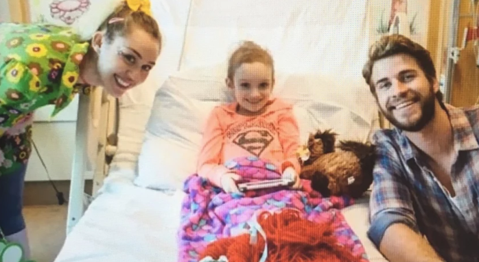 Miley Cyrus and Liam Hemsworth Smile with Cancer Patient Julia Davidson During a Visit at Rady Childrens Hospital