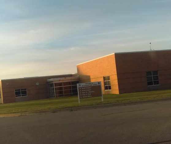 Picture of the entrance road of the schools parking lot.