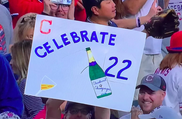 Cleveland+fan+holds+up+poster+celebrating+22+game+winstreak