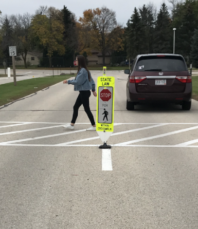 Principle Cabinet Organized The Signs By The Cross Walk  