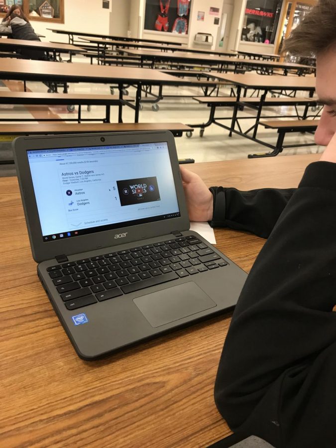 Student looking at World Series final score
