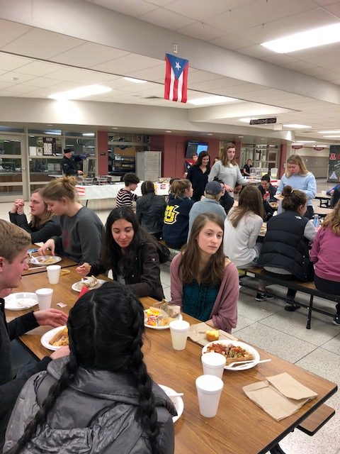 Students enjoy traditional Puerto Rican food at Tertulia event in North Campus commons on Thursday, January 25th after semester finals.