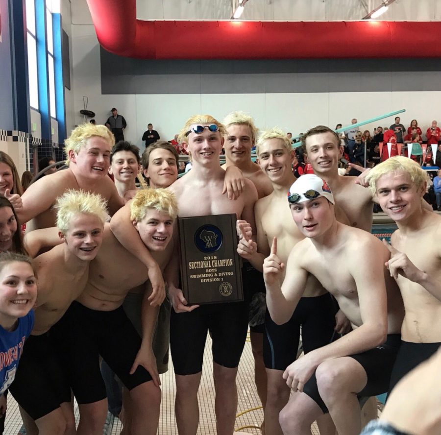 Swim Team members celebrate their victory at Sectionals. 