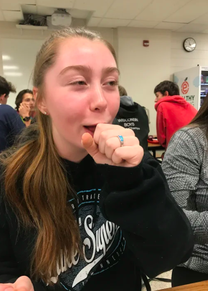 AHS junior Izzy Rahmel fights off a cough at lunch.