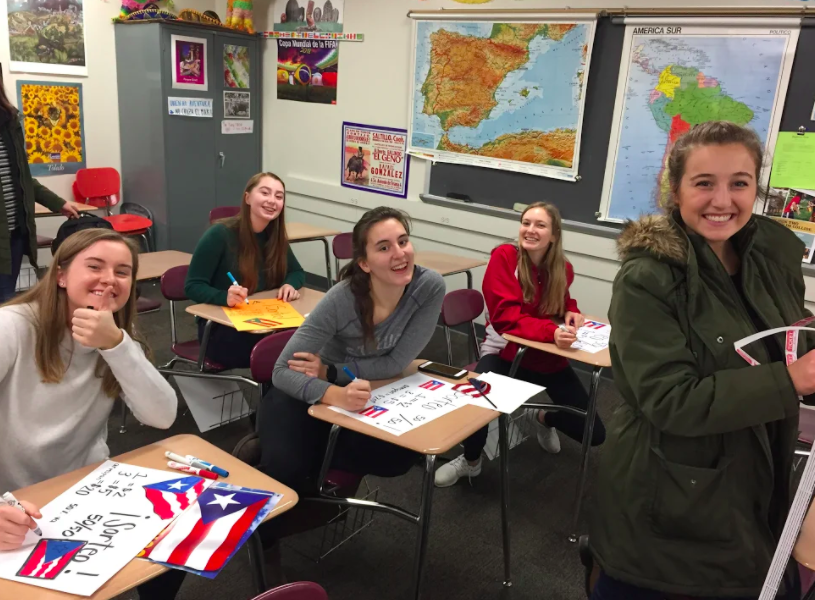 Spanish Honor Society students working on a project.