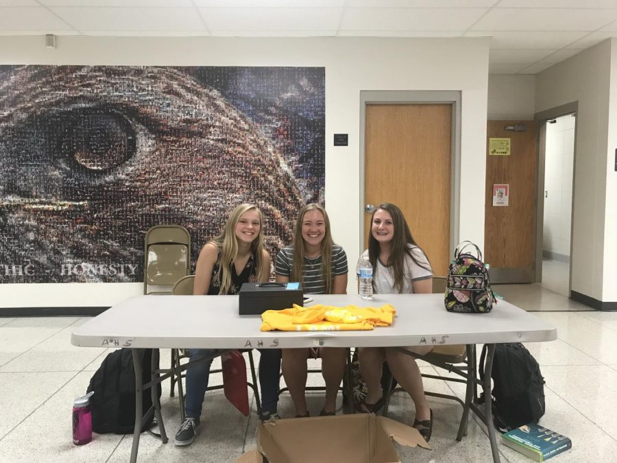 Megan Keenan, Katie Lynch, and Ashley Miller sell Gold in September t-shirts throughout the week.