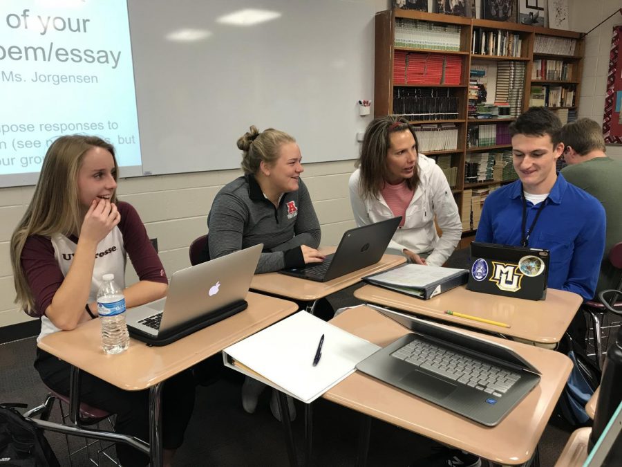 Heidi Hamilton works with a group of her students during class. 
